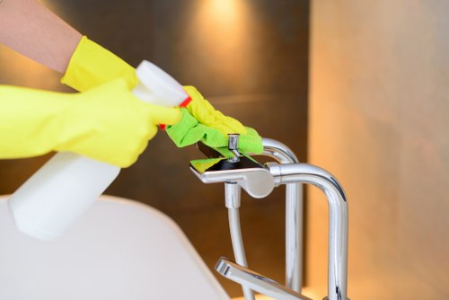 Local gutter cleaning service working on a commercial property