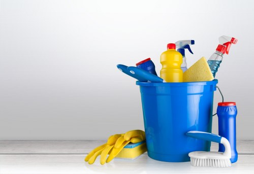 Cleaner applying health and safety practices at the start of service
